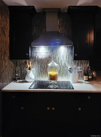 a kitchen with a sink and a stove