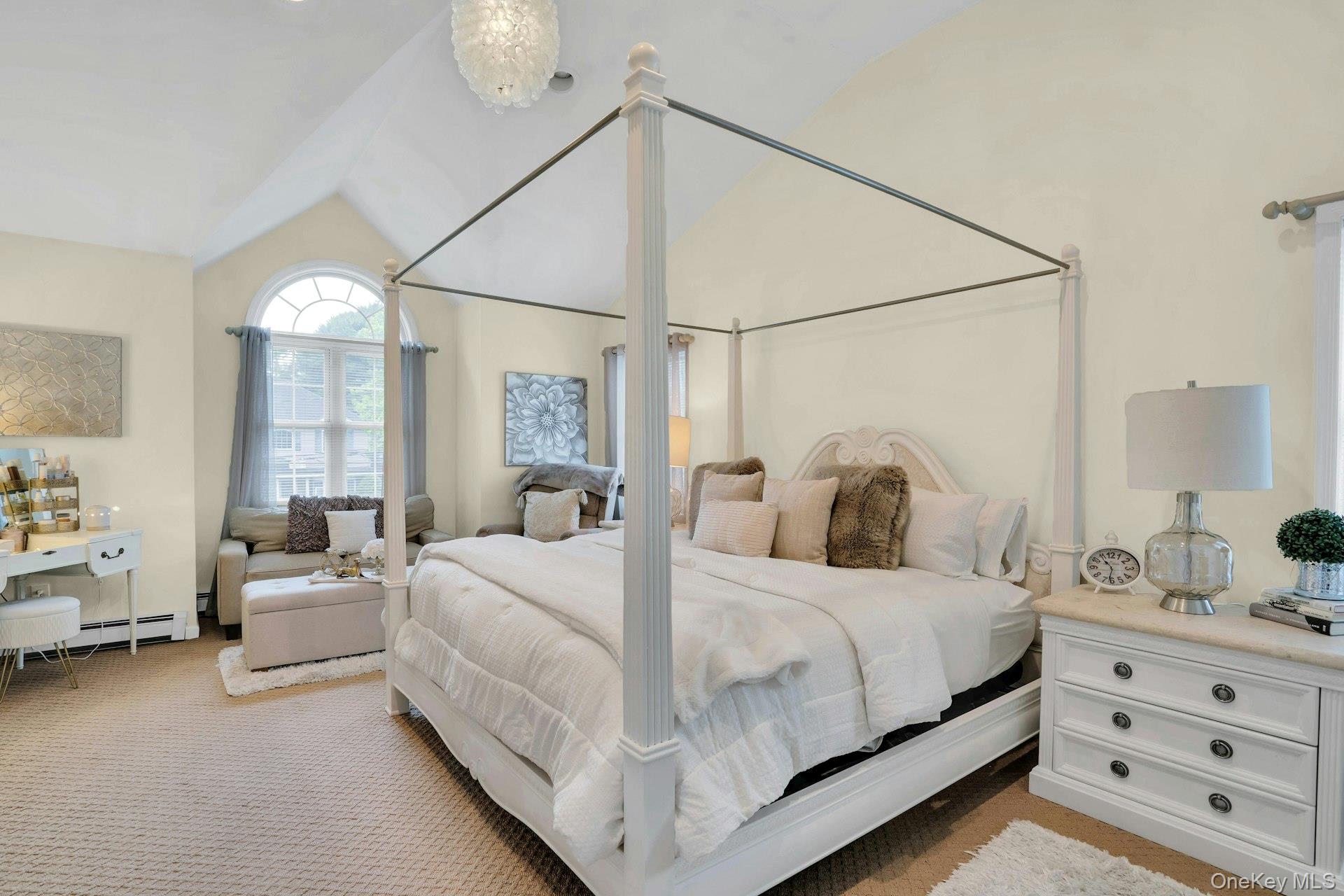 12 Rachel Avenue Commack, NY 11725 - Photo 28 of 50 a bedroom with a bed and a chandelier