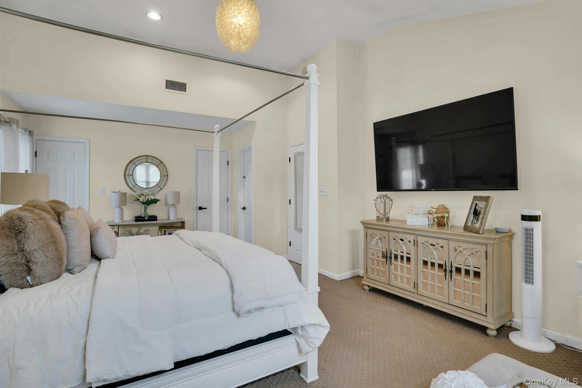 12 Rachel Avenue Commack, NY 11725 - Photo 30 of 50 a bedroom with a bed and a flat screen tv