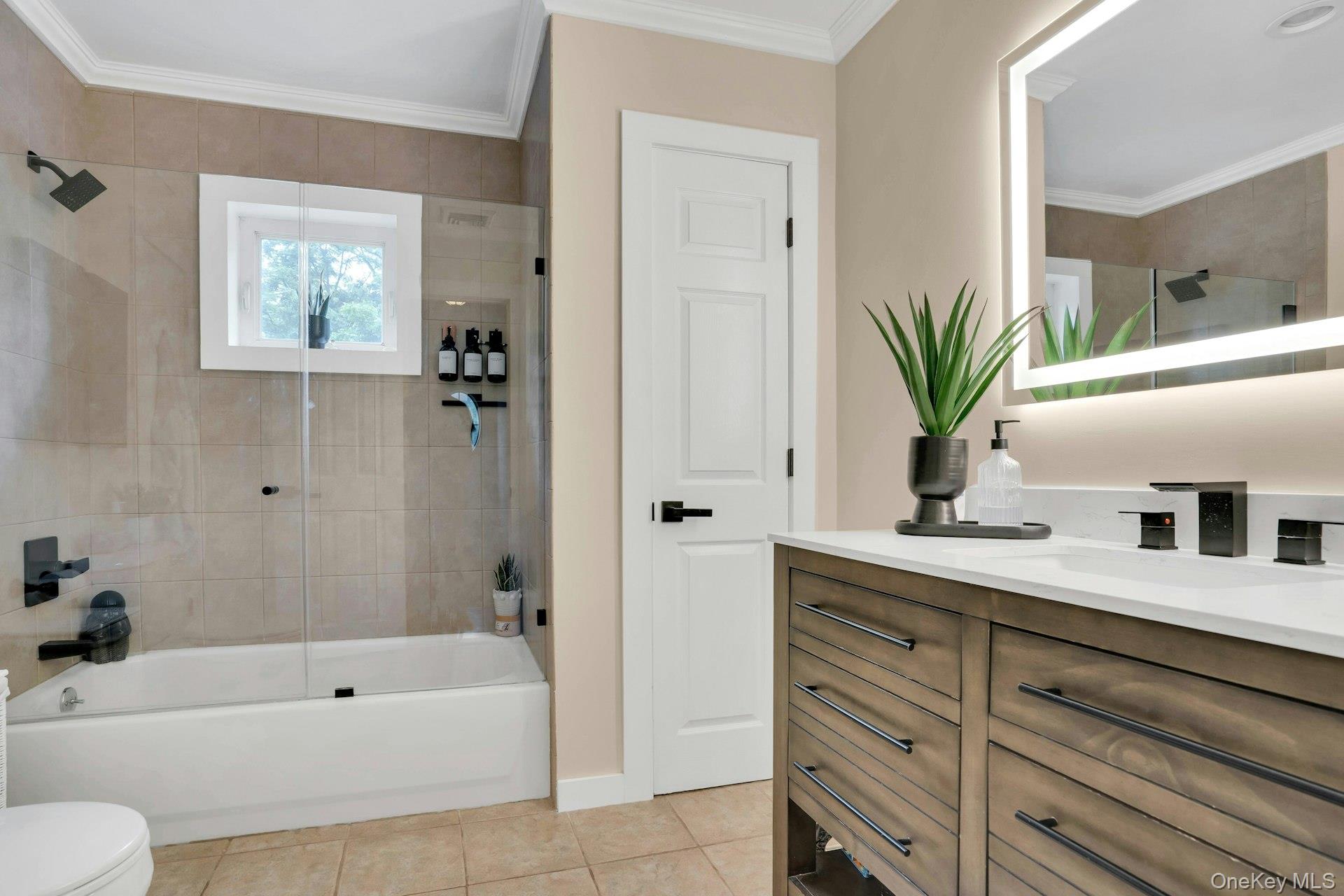 12 Rachel Avenue Commack, NY 11725 - Photo 31 of 50 a bathroom with a tub a sink and a large mirror