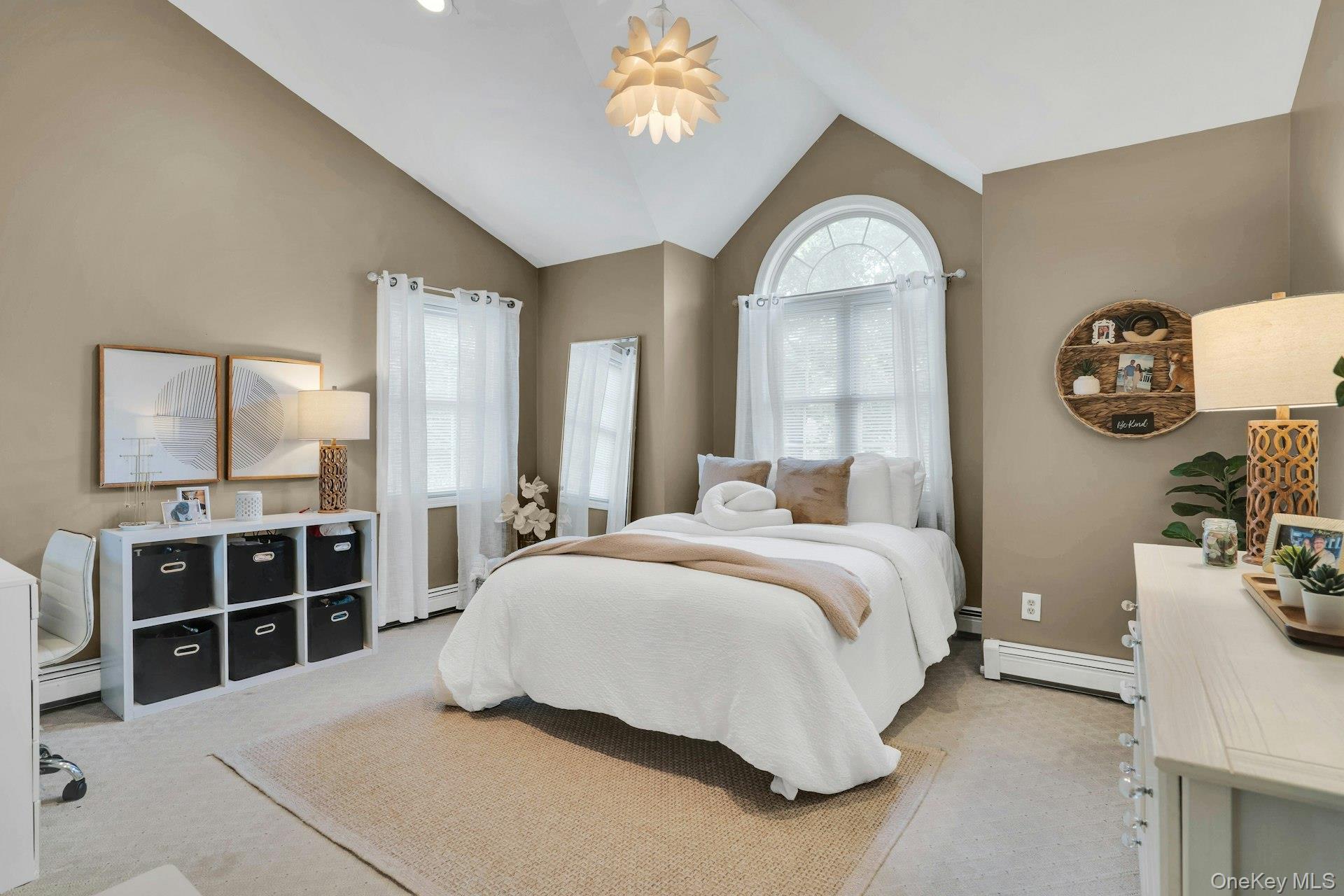 12 Rachel Avenue Commack, NY 11725 - Photo 32 of 50 a bedroom with a bed and a chandelier