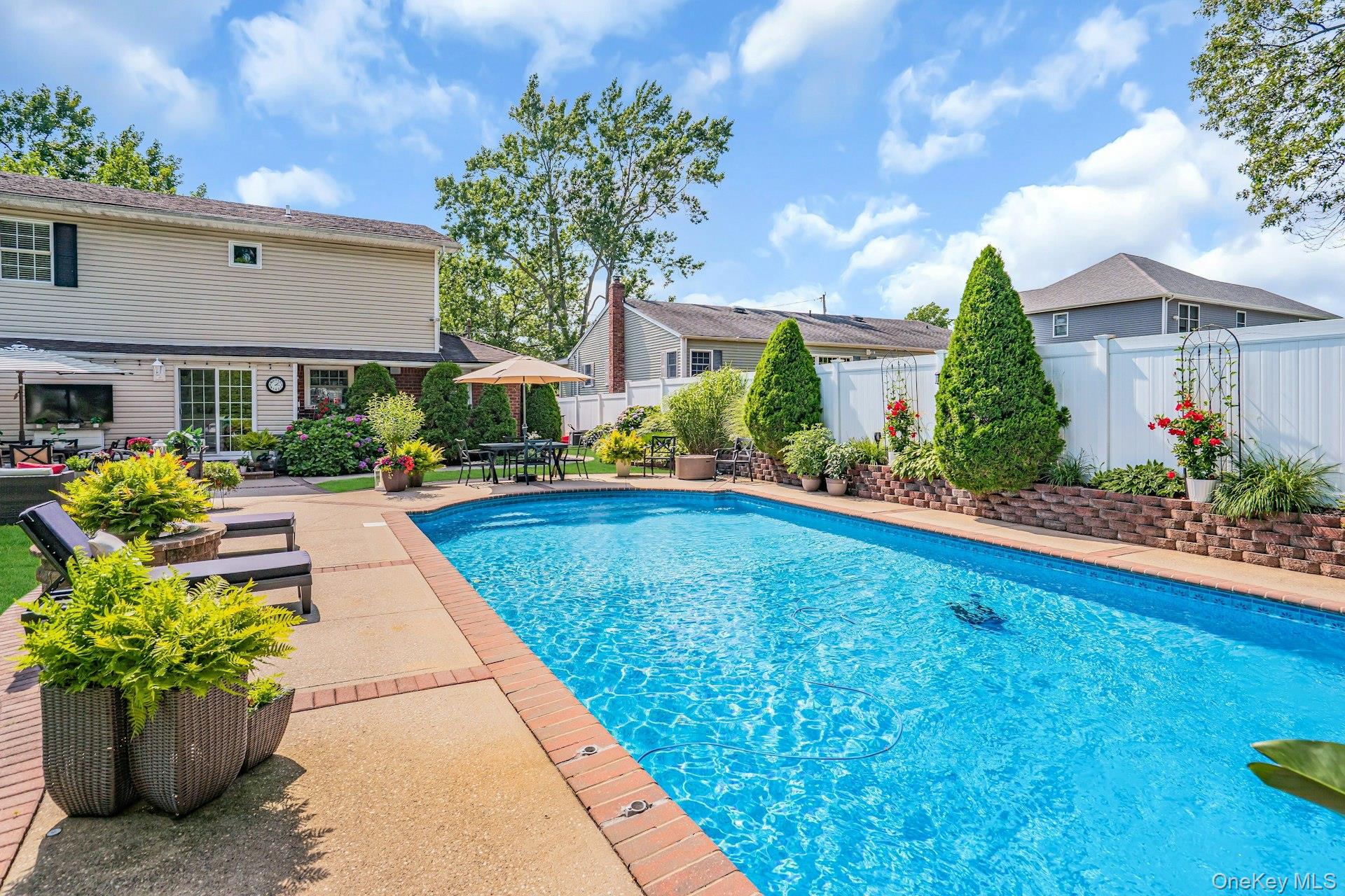 12 Rachel Avenue Commack, NY 11725 - Photo 39 of 50 a view of swimming pool with outdoor seating