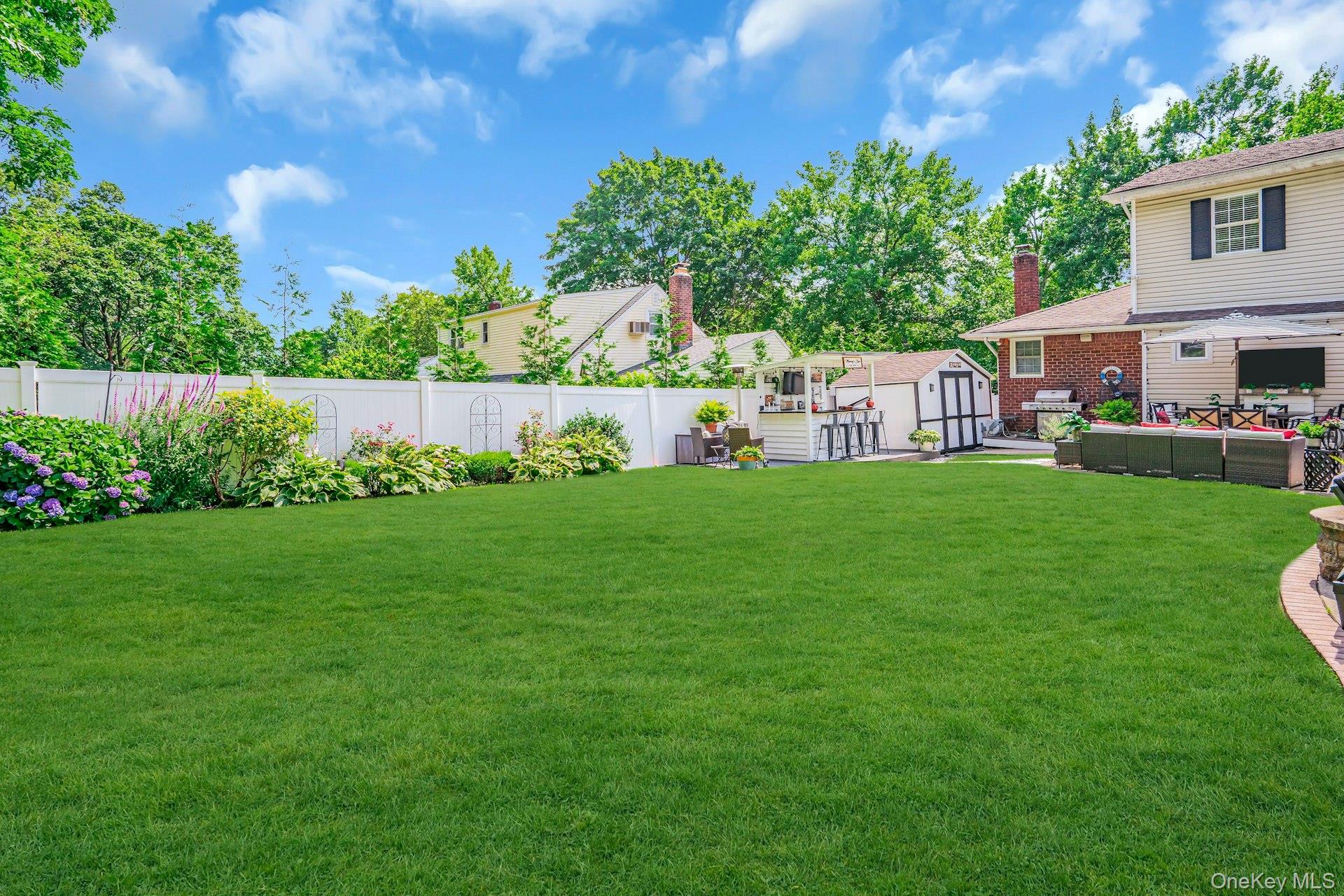 12 Rachel Avenue Commack, NY 11725 - Photo 41 of 50 a view of an house with backyard space and garden