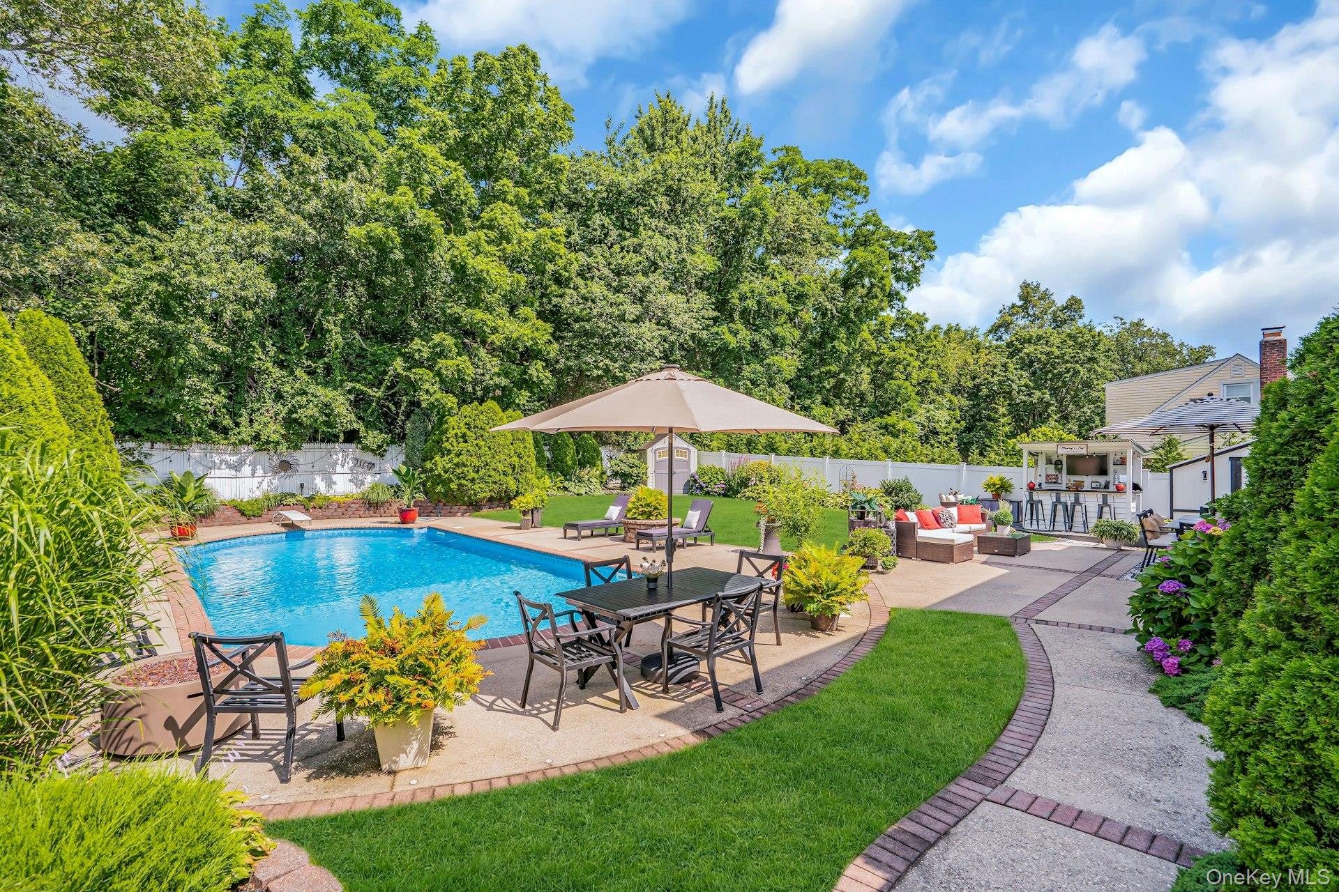 12 Rachel Avenue Commack, NY 11725 - Photo 43 of 50 a view of a chair and table on the garden