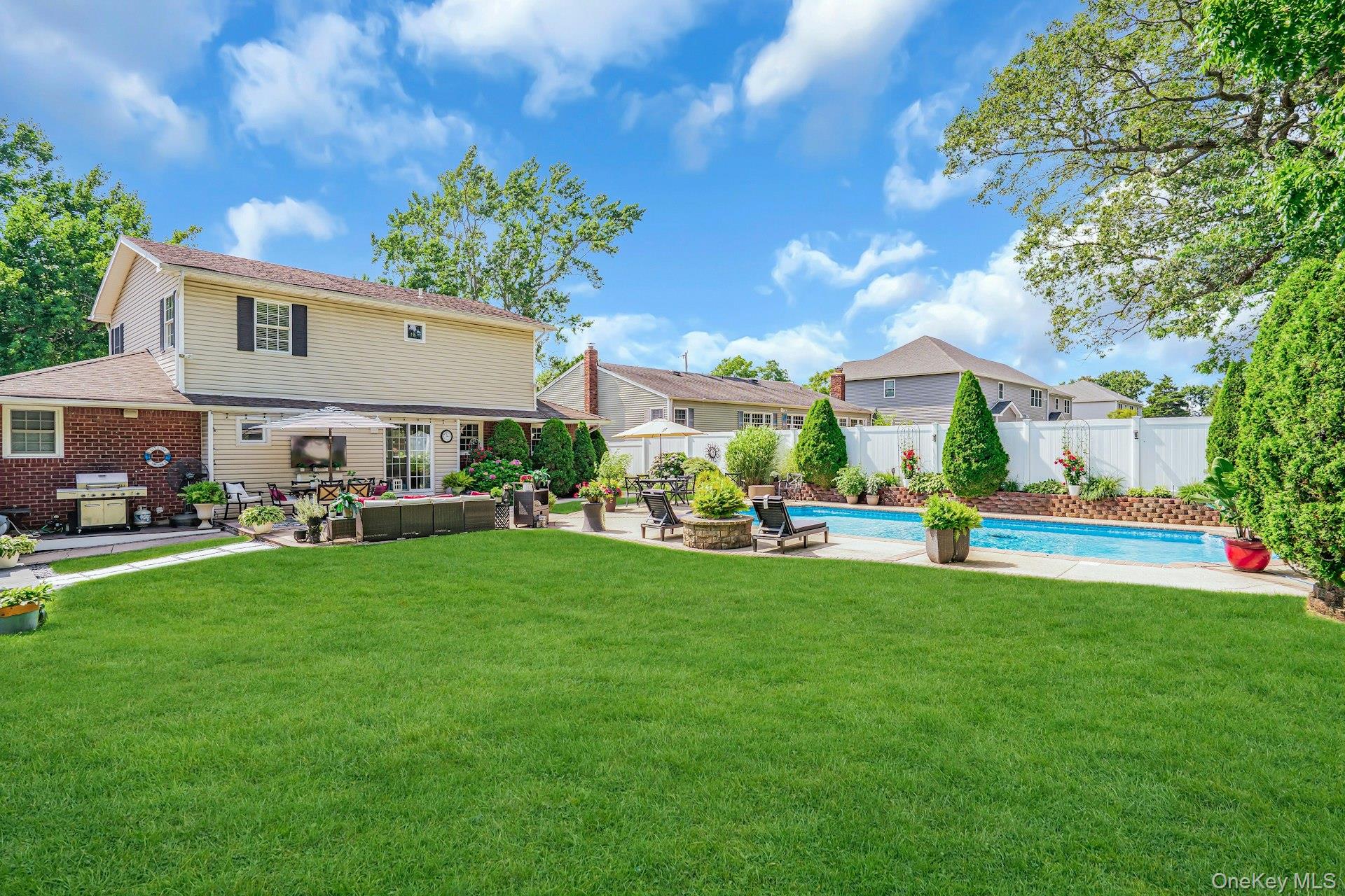 12 Rachel Avenue Commack, NY 11725 - Photo 45 of 50 a front view of house with yard and outdoor seating