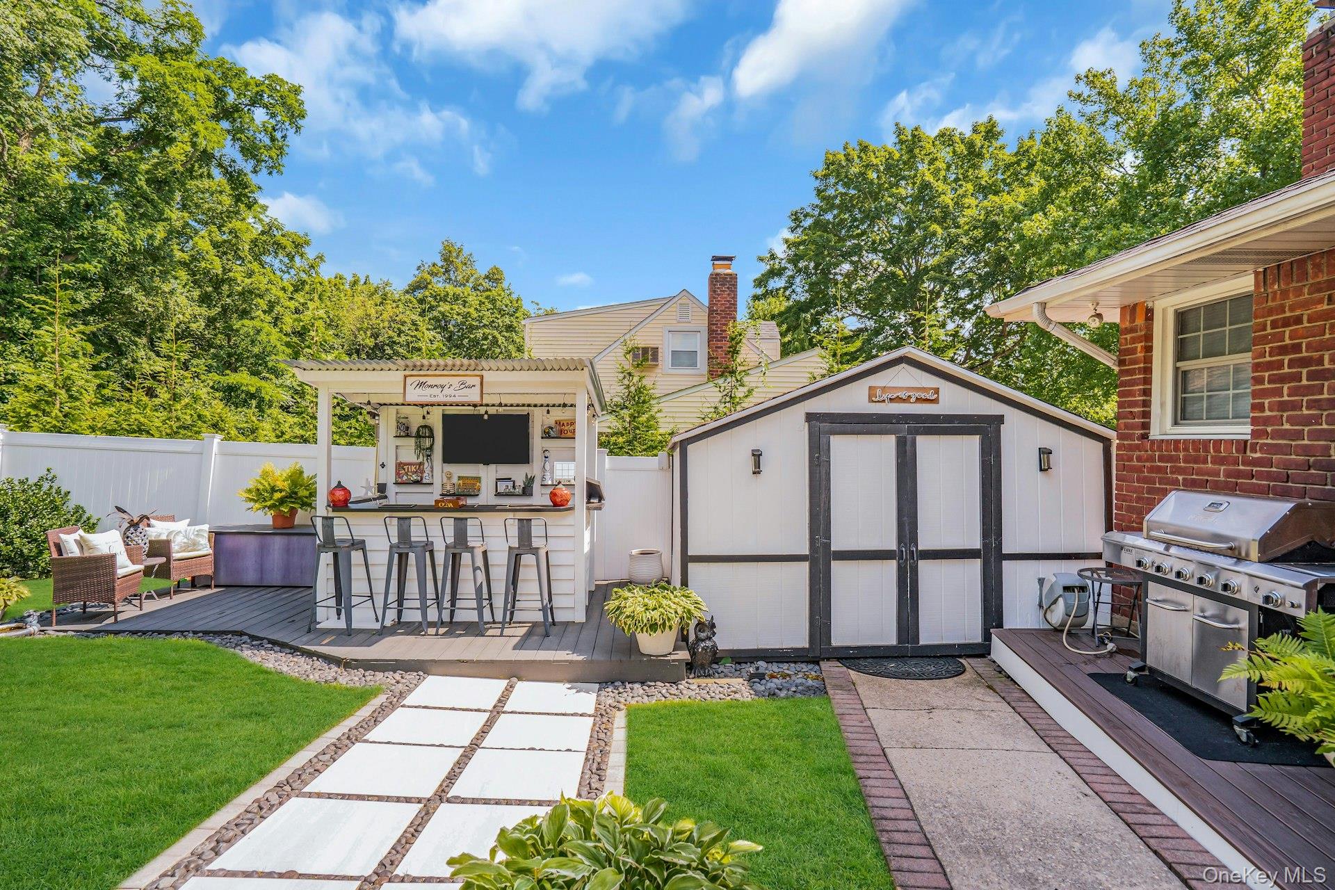 12 Rachel Avenue Commack, NY 11725 - Photo 49 of 50 a front view of a house with garden