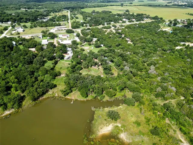 a view of a lake with a yard