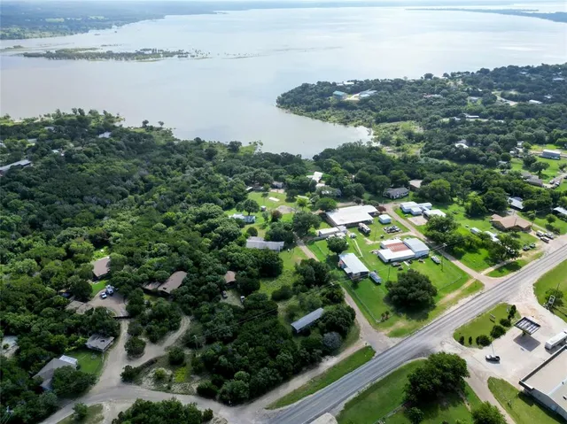 an aerial view of a house with yard