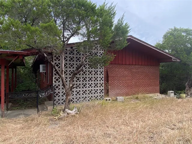 a view of a room with wooden walls
