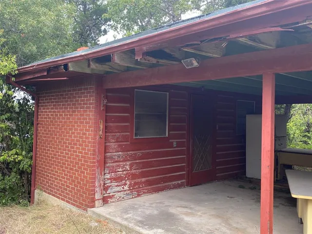a bed room with a bed table and chair