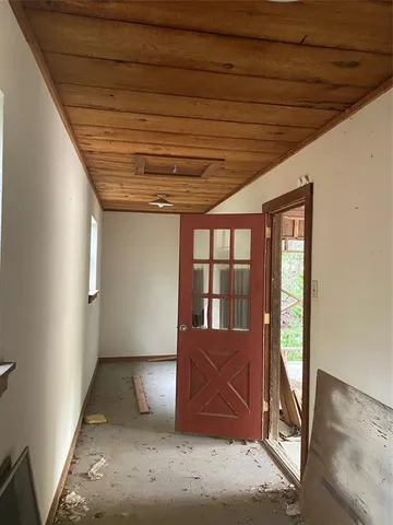 a view of a wooden house with a yard