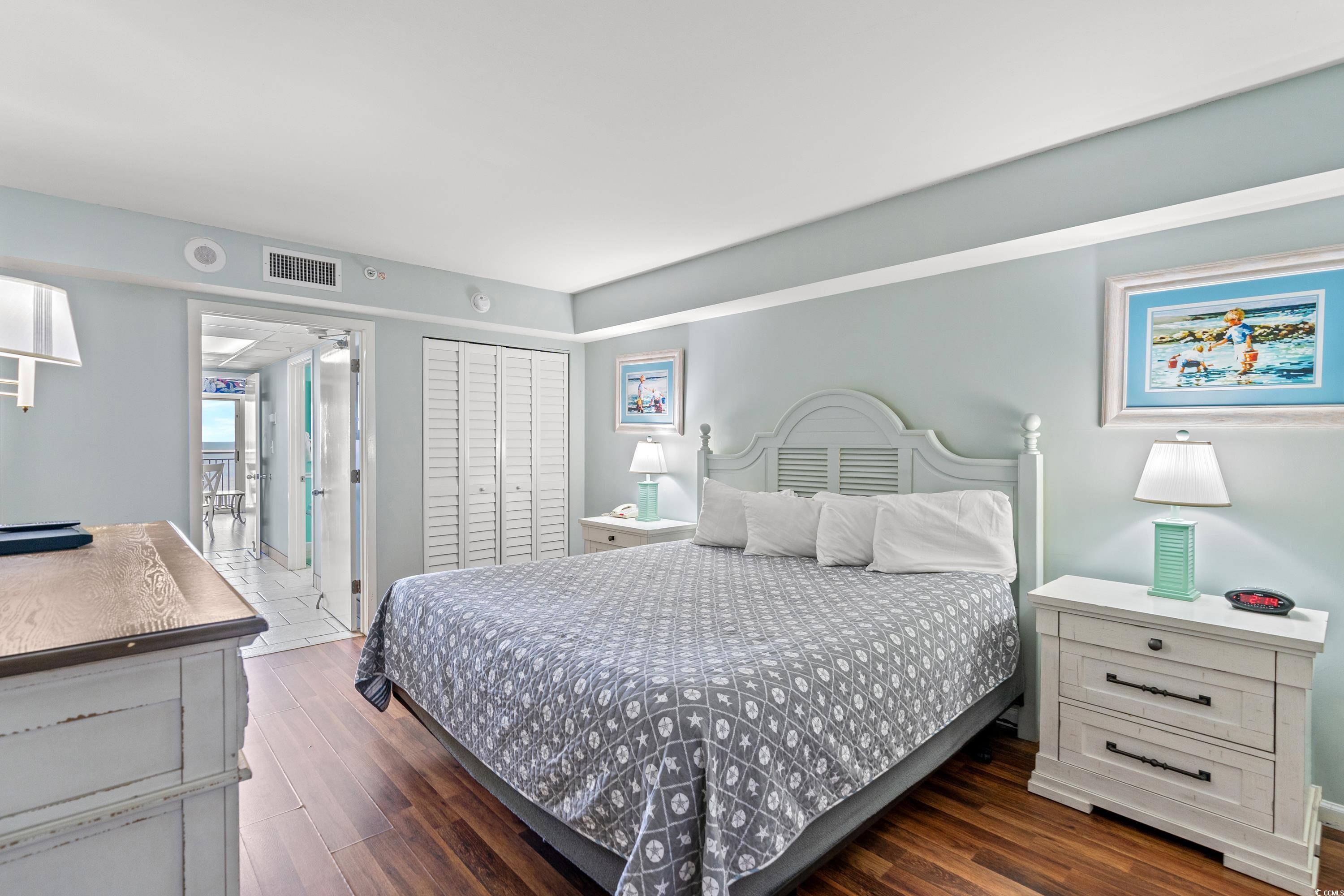 2000 North Ocean Boulevard, Unit 1612 Myrtle Beach, SC 29577 - Photo 2 of 21 Bedroom featuring a closet and dark hardwood / wood-style floors