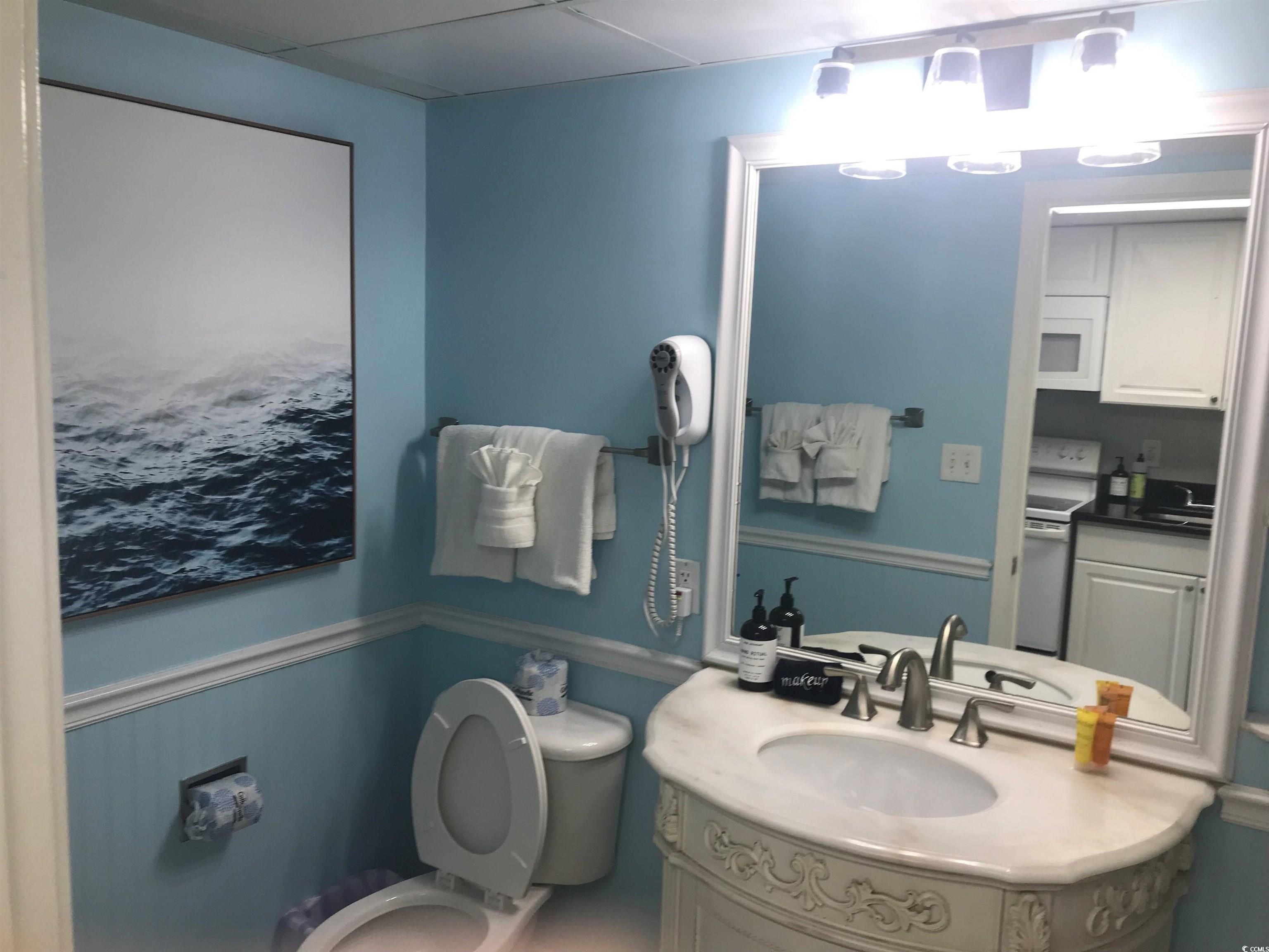 2000 North Ocean Boulevard, Unit 1612 Myrtle Beach, SC 29577 - Photo 10 of 21 Half bath with toilet and vanity