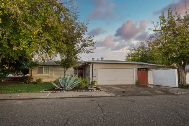 front view of house next to a yard