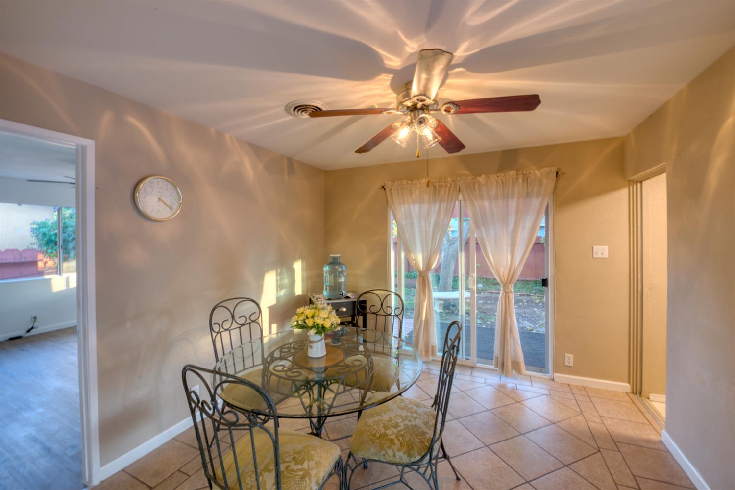 902 Waller Street Gustine, CA 95322 - Photo 14 of 32 a view of a dining room with furniture and chandelier fan