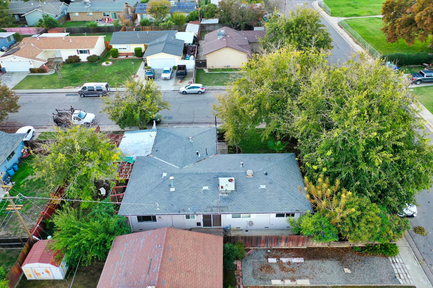 902 Waller Street Gustine, CA 95322 - Photo 30 of 32 an aerial view of a house with a yard and garden