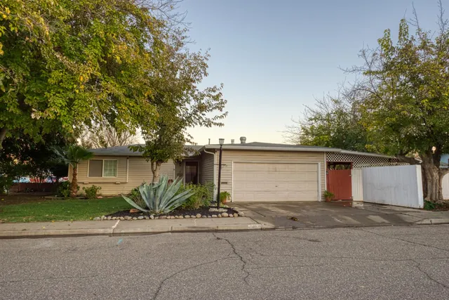 front view of house next to a yard