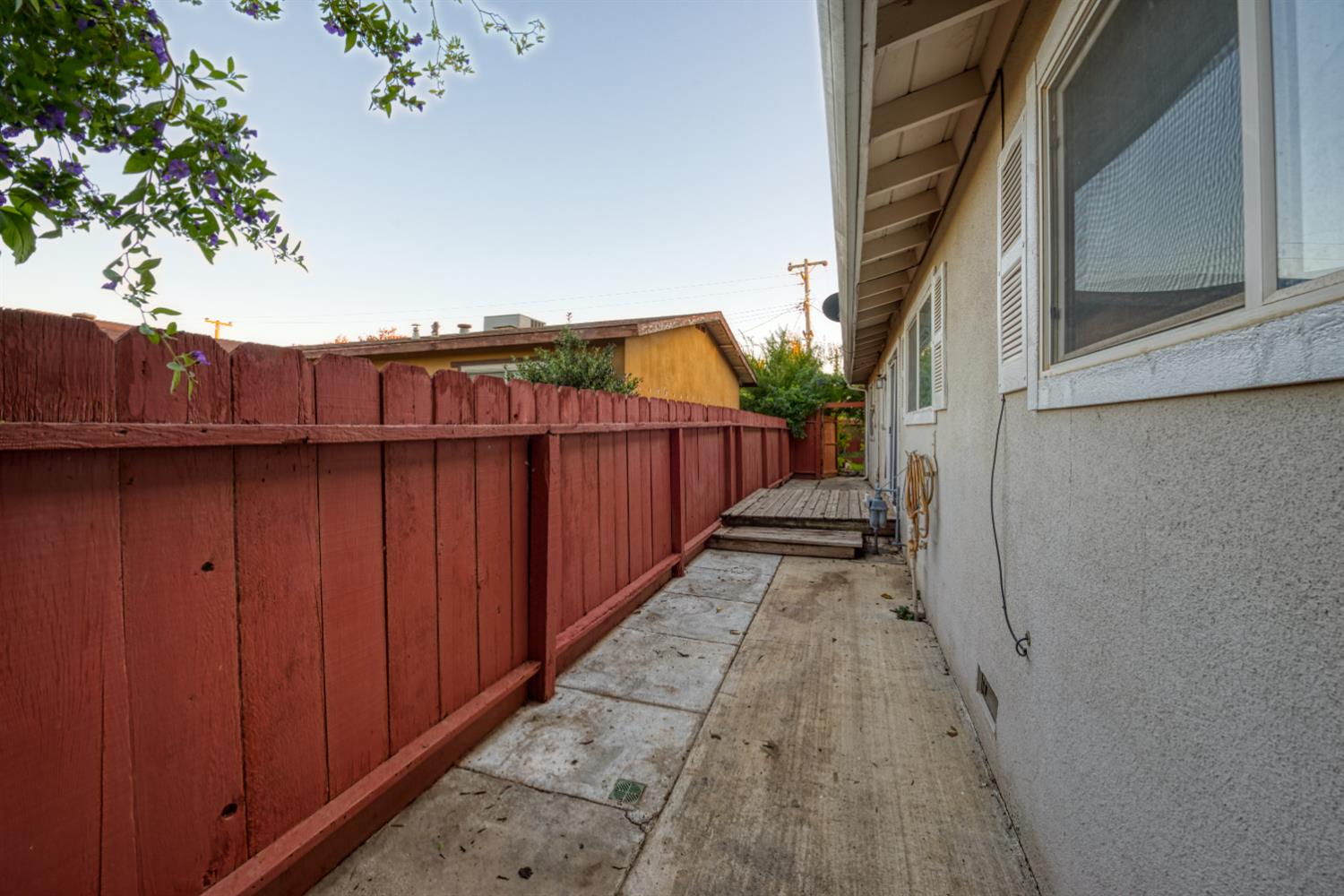 902 Waller Street Gustine, CA 95322 - Photo 8 of 32 a view of a pathway of a house with wooden fence