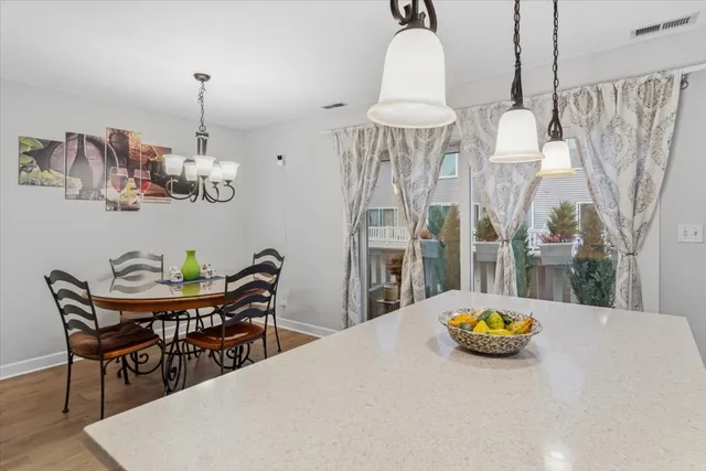 a view of a dining room and chandelier