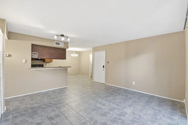 a view of a kitchen with wooden floor