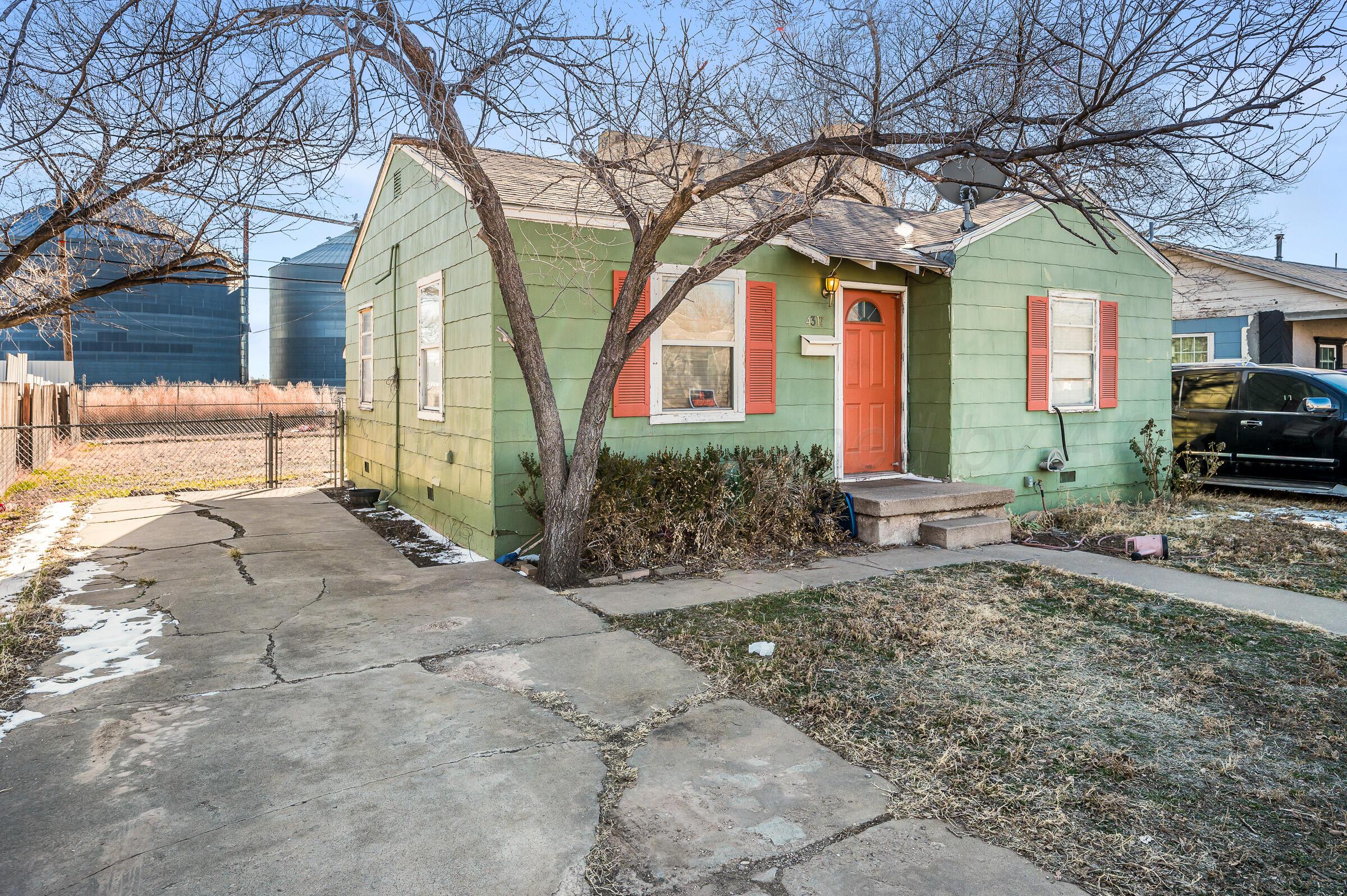 4317 South Polk Street Amarillo, TX 79110 - Photo 2 of 13 a front view of a house with garden