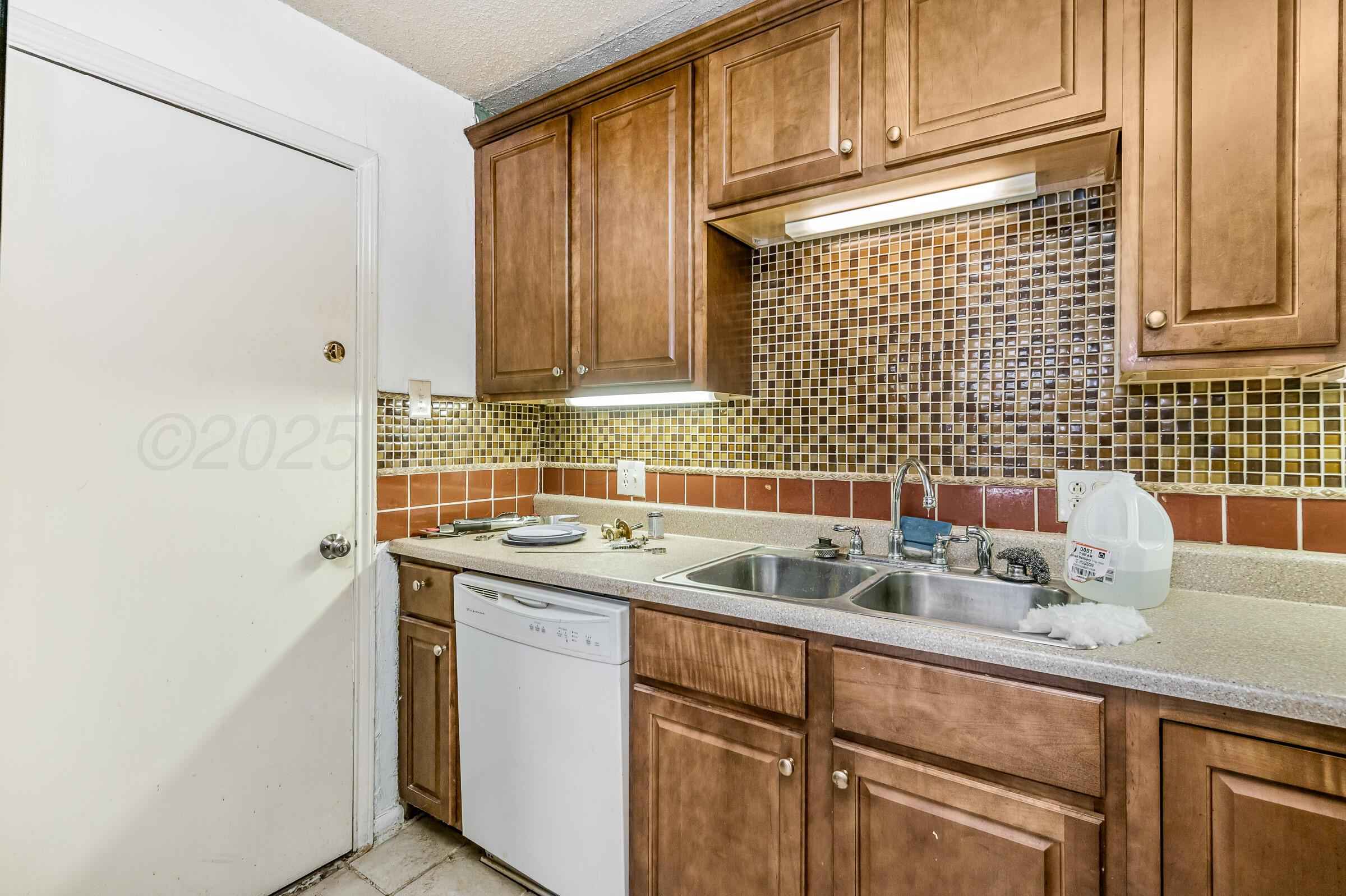 4317 South Polk Street Amarillo, TX 79110 - Photo 3 of 13 a view of a kitchen with sink and cabinets