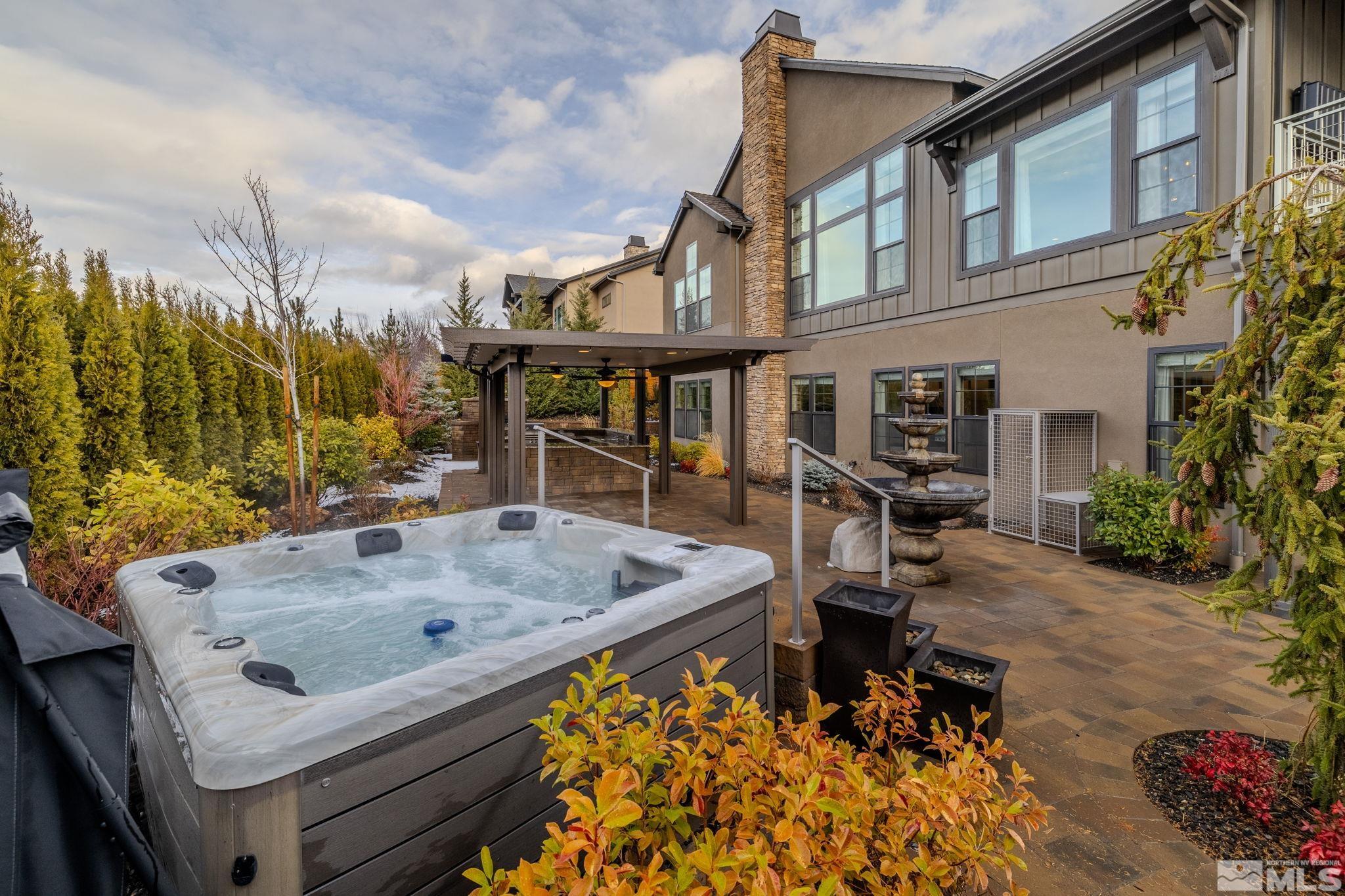 4005 Whispering Pine Loop Reno, NV 89519 - Photo 30 of 39 a view of roof deck with table and chairs and potted plants