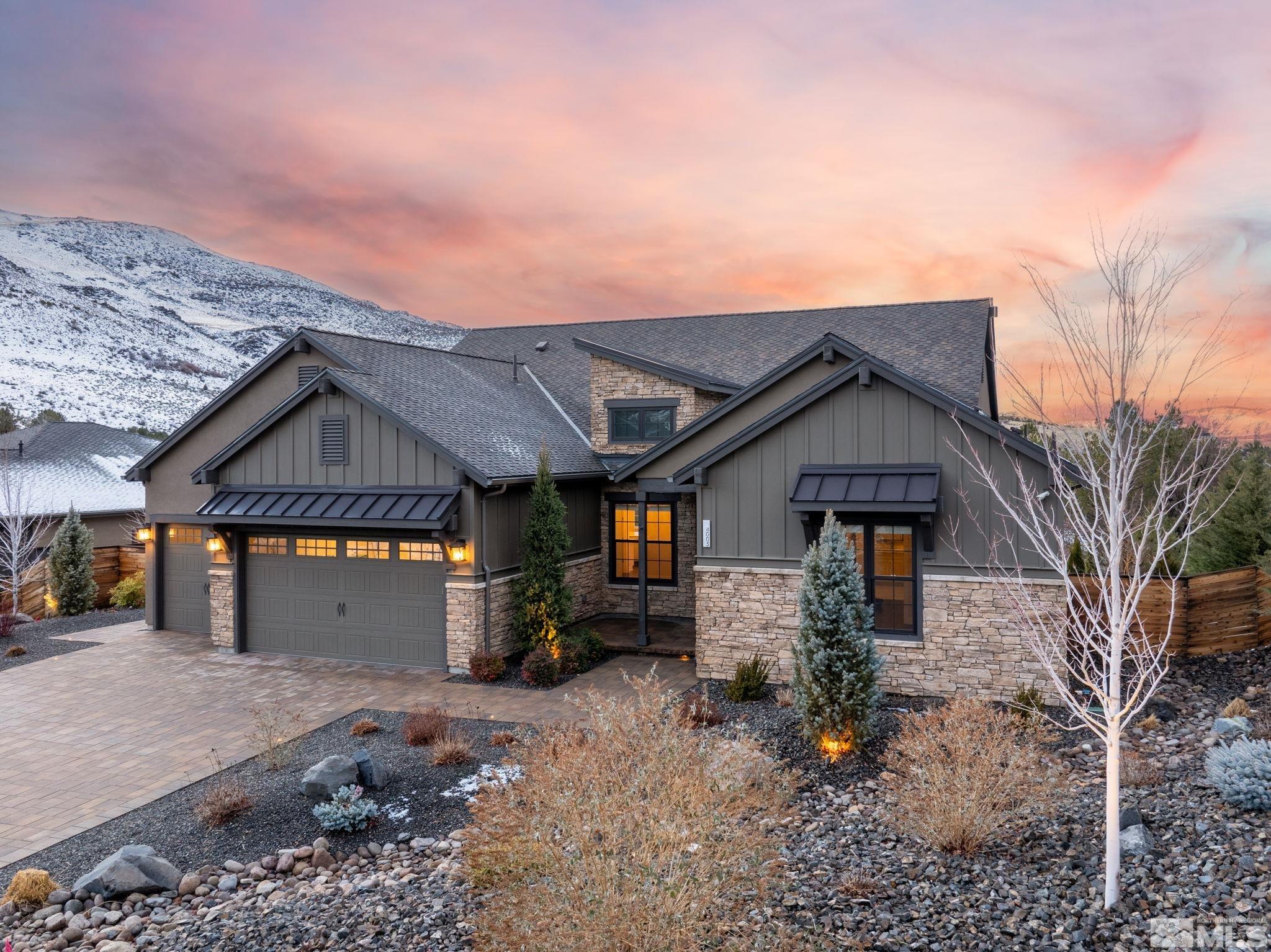 4005 Whispering Pine Loop Reno, NV 89519 - Photo 39 of 39 a front view of a house with a yard and garage