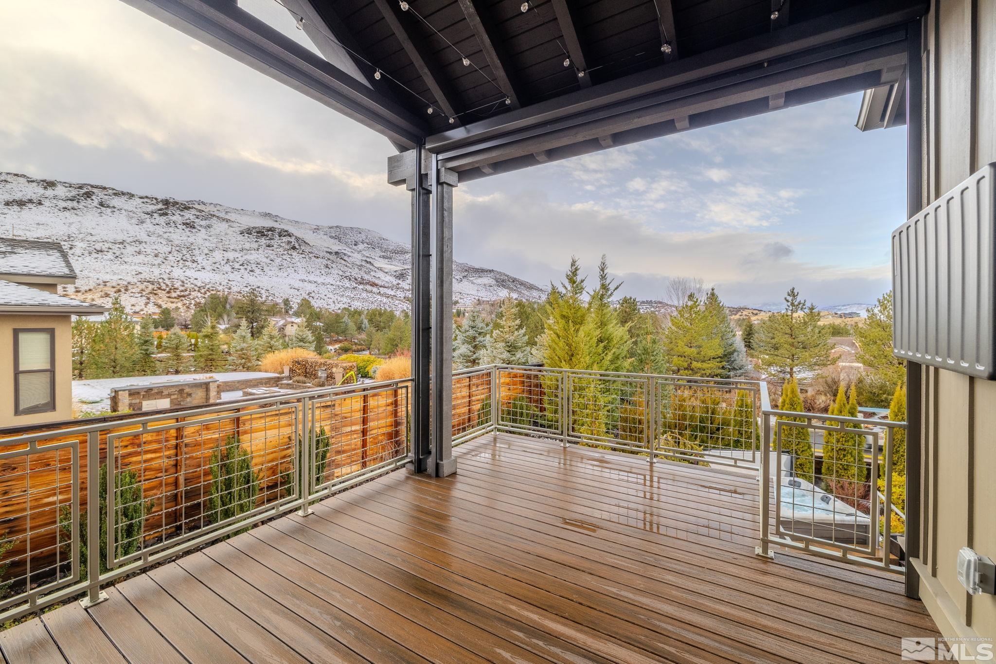 4005 Whispering Pine Loop Reno, NV 89519 - Photo 6 of 39 a view of an empty room with wooden floor and iron stairs