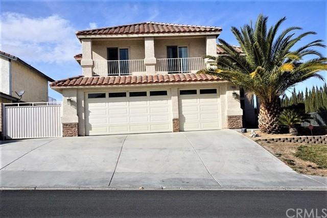17810 Rancho Bonita Road Victorville, CA 92395 - Photo 1 of 1 a house with palm tree in front of it