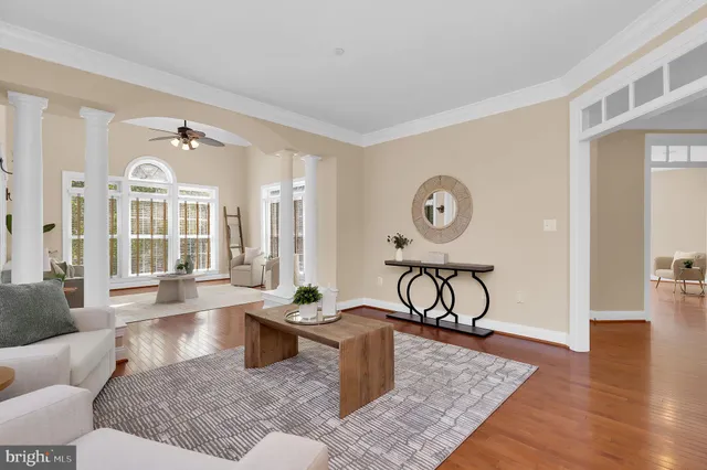 a living room with furniture and large windows