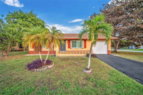 a house with a tree in front of it