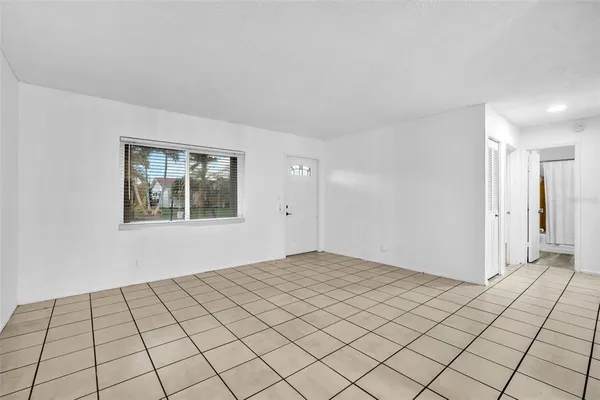 a view of an empty room and window