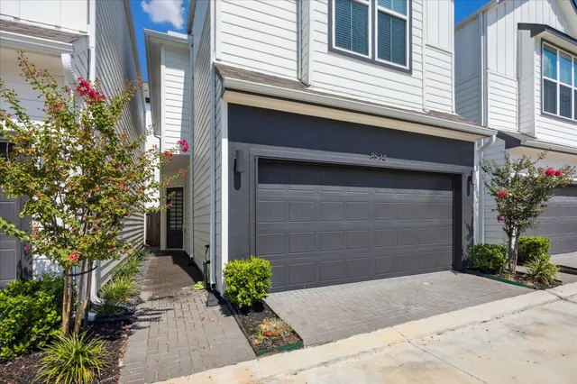 a house with flowers in front of it