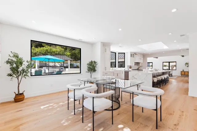 a kitchen with stove and cabinets