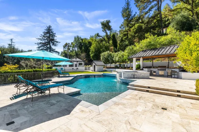 a view of washer and dryer with kitchen view