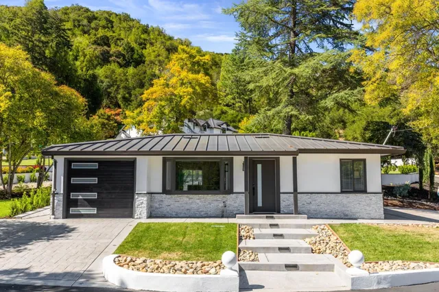 an aerial view of a house with a swimming pool