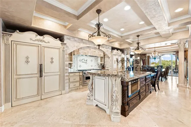 a kitchen with stainless steel appliances granite countertop a stove and a sink