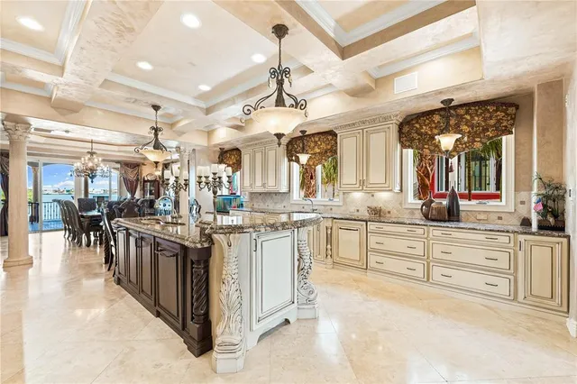 a dining room with furniture and a chandelier