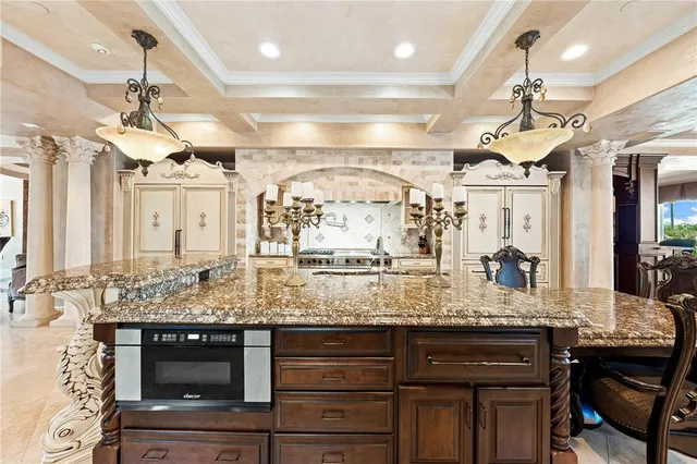 a view of a dining room with furniture and chandelier
