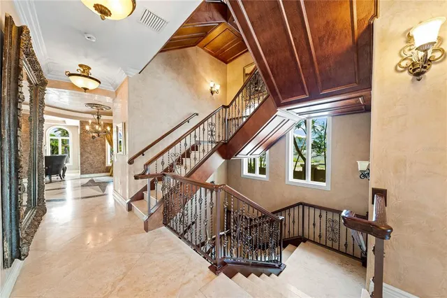 a bed room with a bed and a chandelier