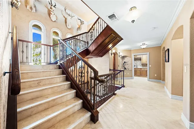 a living room with fireplace furniture and a flat screen tv
