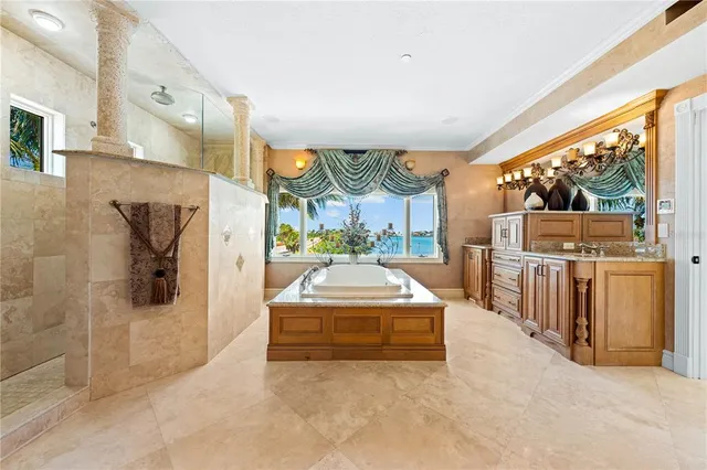 a room with furniture a piano and a chandelier