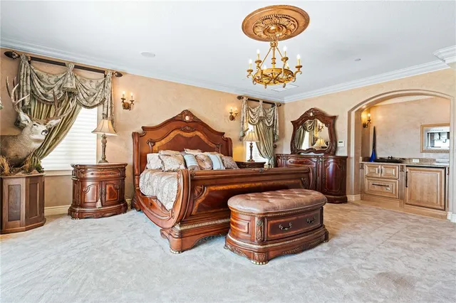 a kitchen with a stove a refrigerator and a dining table