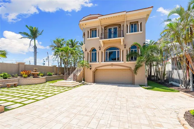 a kitchen with stainless steel appliances kitchen island granite countertop a refrigerator and a stove