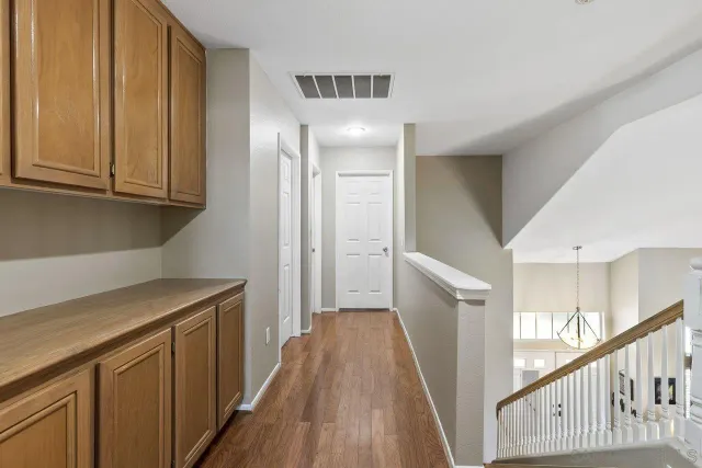 a view of a kitchen from the hallway