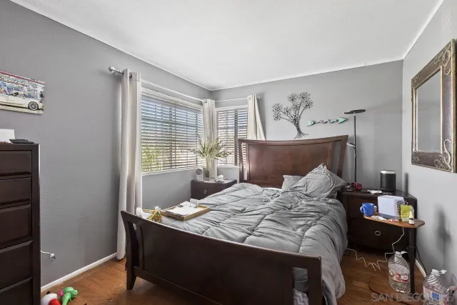 a bedroom with a bed and window