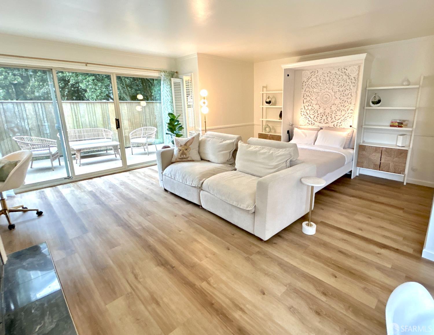 175 Red Rock Way, Unit 101K San Francisco, CA 94131 - Photo 11 of 25 a living room with furniture and large windows