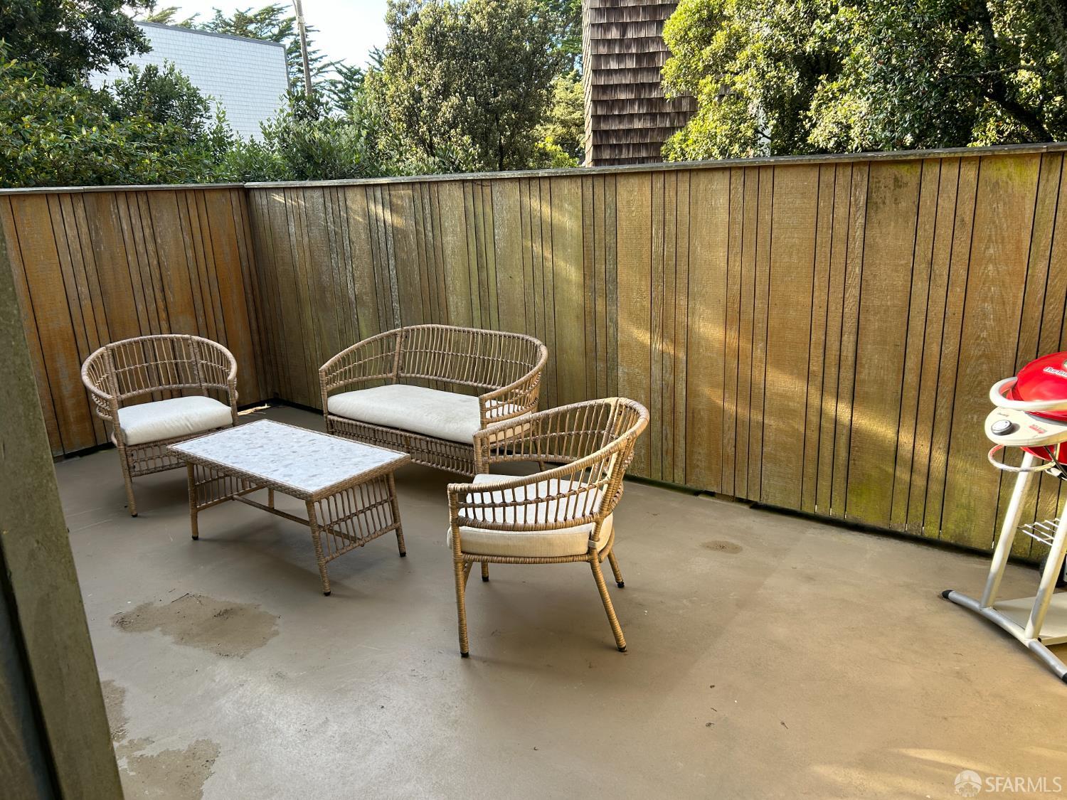 175 Red Rock Way, Unit 101K San Francisco, CA 94131 - Photo 16 of 25 an outdoor sitting area with a couch chair and fire pit