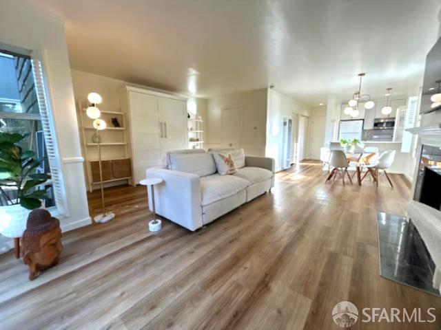 175 Red Rock Way, Unit 101K San Francisco, CA 94131 - Photo 2 of 25 a living room with furniture and a fireplace
